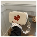 Chic beige crossbody heart bag with dual zippers and colorful woven shoulder strap - Off White