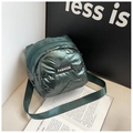 Detail of a dark green quilted mini bag with glossy finish and 'FASHION' label - Dark Green