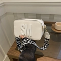 White faux leather camera bag with wide geometric strap and SM letter logo detail - White