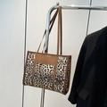 Large capacity tote bag with leopard print pattern and dark brown leather straps - Brown