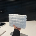 White quilted puffer clutch bag with square stitching and minimalist cloud design - White