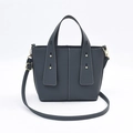 Dark grey pebble leather bucket bag with white contrast stitching and gold hardware - Gray