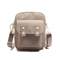 Minimalist beige canvas crossbody bag with white resin buttons and adjustable woven strap - Khaki