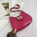 Fashionable hot pink shoulder bag with silver metallic bow and chain strap detail - Rose Red