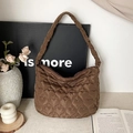 Brown quilted tote bag featuring heart pattern stitching and zip closure for women - Brown