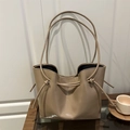 Minimalist large khaki patent leather tote bag with stylish knot details and shoulder straps - Khaki