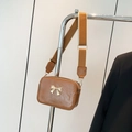 Caramel brown bow crossbody bag with ruched texture and adjustable wide strap - Brown