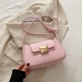 Pink faux leather baguette shoulder bag with golden metal buckle and knotted strap - Pink