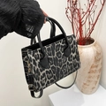 Fashionable leopard print handbag with black handles and gold hardware details - Black without Pendant