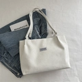 White corduroy tote bag with vertical stripes and fashion label for daily casual wear - White