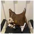 Detail of dark brown crinkled nylon hobo bag with logo patch and cute alpaca pendant - Coffee with Pendant