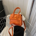 Mini glossy orange crossbody bag with crocodile texture and metal finish highlights - Orange