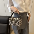 Mini leopard print pillow bag with woven texture and top handles for casual styling - Leopard Print