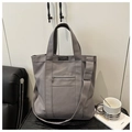 Γκρι πάνινη τσάντα tote με ετικέτα fashion instinct και μπροστινή τσέπη με φερμουάρ - Γκρι