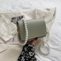 Light green faux leather square handbag with white pearl handle and golden logo - Green