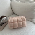 Quilted puffer makeup bag in coral pink with textured square stitching and zipper - Pink