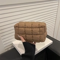 Quilted puffer makeup bag in brown with sleek zipper closure for stylish travel storage - Brown