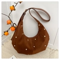 Detail of a dark brown crescent bag with golden studs on faux suede fabric - Brown