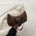 Deep brown pleated shoulder bag with large metal buckle and retro faux leather finish - Brown