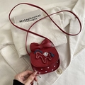 Red crossbody mini bag for girls featuring a large bow and embroidered horse detail - Red