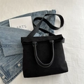 Matte black large capacity tote bag with circular handles and wide shoulder strap - Black