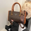 Borsa tote vintage con monogramma, manici arancioni e tracolla in tela larga - Nero