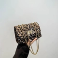 Leopard print crossbody bag with gold chain strap and rectangular turn-lock closure - Brown