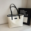 Minimalist cream tote bag with black trim and long shoulder straps for daily commute - Off White