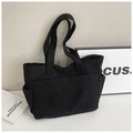 Bolso tote grande de pana negra para mujer con bolsillos y un diseño minimalista - Negro
