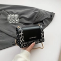 Chic vintage leopard print chain crossbody bag with black flap and gold strap - Black