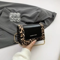 Fashionable leopard print chain crossbody bag with black leather flap and gold strap - Yellow
