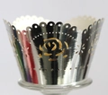 Macro detail of laser-cut silver rose pattern cupcake wrappers with reflective mirror finish - Reflective Silver