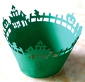 Detail of laser-cut green Halloween cupcake wrappers with castle and pumpkin patterns - Dark Green