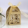 Detail of laser-cut wedding candy box with golden bird design and ribbon bow - Beige Gold