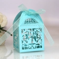 Close-up of laser-cut light blue birdcage candy box with elegant ribbon decoration - Pearl Pale Blue