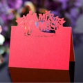 Red laser-cut Mr & Mrs wedding place card with heart-shaped silhouette on floral background - Pearlescent Red