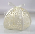 Elegant ivory laser-cut gift box with hollow floral patterns and silk ribbon bow - Ivory