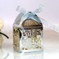 Silver birdcage candy box with intricate hollow design and light blue ribbon bow - Reflective Silver