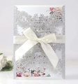 Elegant laser-cut silver glitter snowflake invitation card with a white satin ribbon bow - Silver Glitter