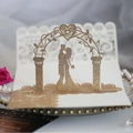 Golden 3D laser cut wedding invitation card with glitter finish and couple silhouette - Rose Gold