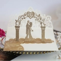 3D laser cut wedding invitation card featuring golden glitter couple and heart arch - Rose Gold