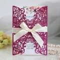 Laser cut magenta glitter wedding invitation with beige satin bow and floral inner card - Fuschia