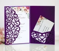 Close-up of laser-cut heart pattern wedding invitation with floral insert and RSVP card - Dark Purple