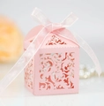 Pink laser-cut lace wedding favor box with a delicate silk ribbon bow and floral pattern - Pink