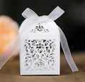Elegant white laser-cut wedding favor box with intricate heart patterns and ribbon - White