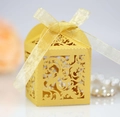 Golden laser-cut wedding favor box with floral patterns and a matching silk ribbon bow - Gold