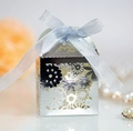 Laser-cut silver wedding candy box with intricate floral pattern and light blue ribbon - Reflective Silver