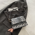Leopard print crossbody bag with grey faux fur texture and silver metal hardware - Black