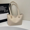 Minimalist beige leather tote bag with elegant gold metal hardware and long shoulder straps - Off White