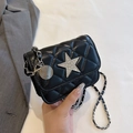 Black quilted crossbody bag with rhinestone star and silver chain strap details - Black